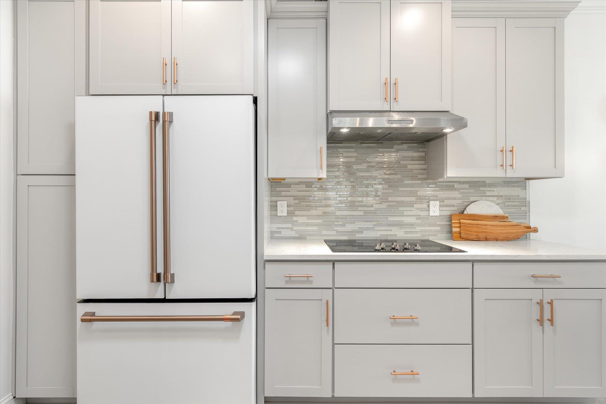 82 Timoga Trail St. Augustine, FL 32084 - Photo 19 of 62 a kitchen with white cabinets and white appliances