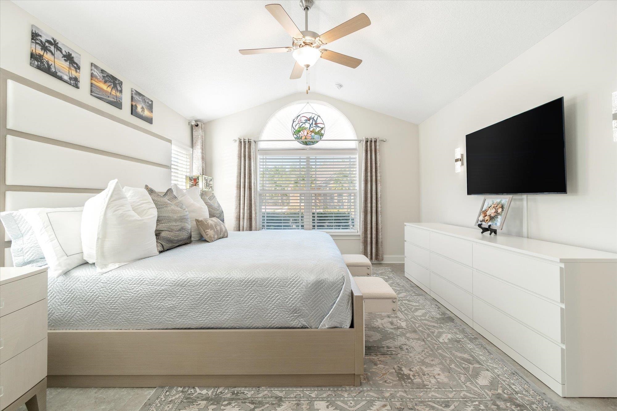 82 Timoga Trail St. Augustine, FL 32084 - Photo 24 of 62 a spacious bedroom with a large bed and a flat screen tv