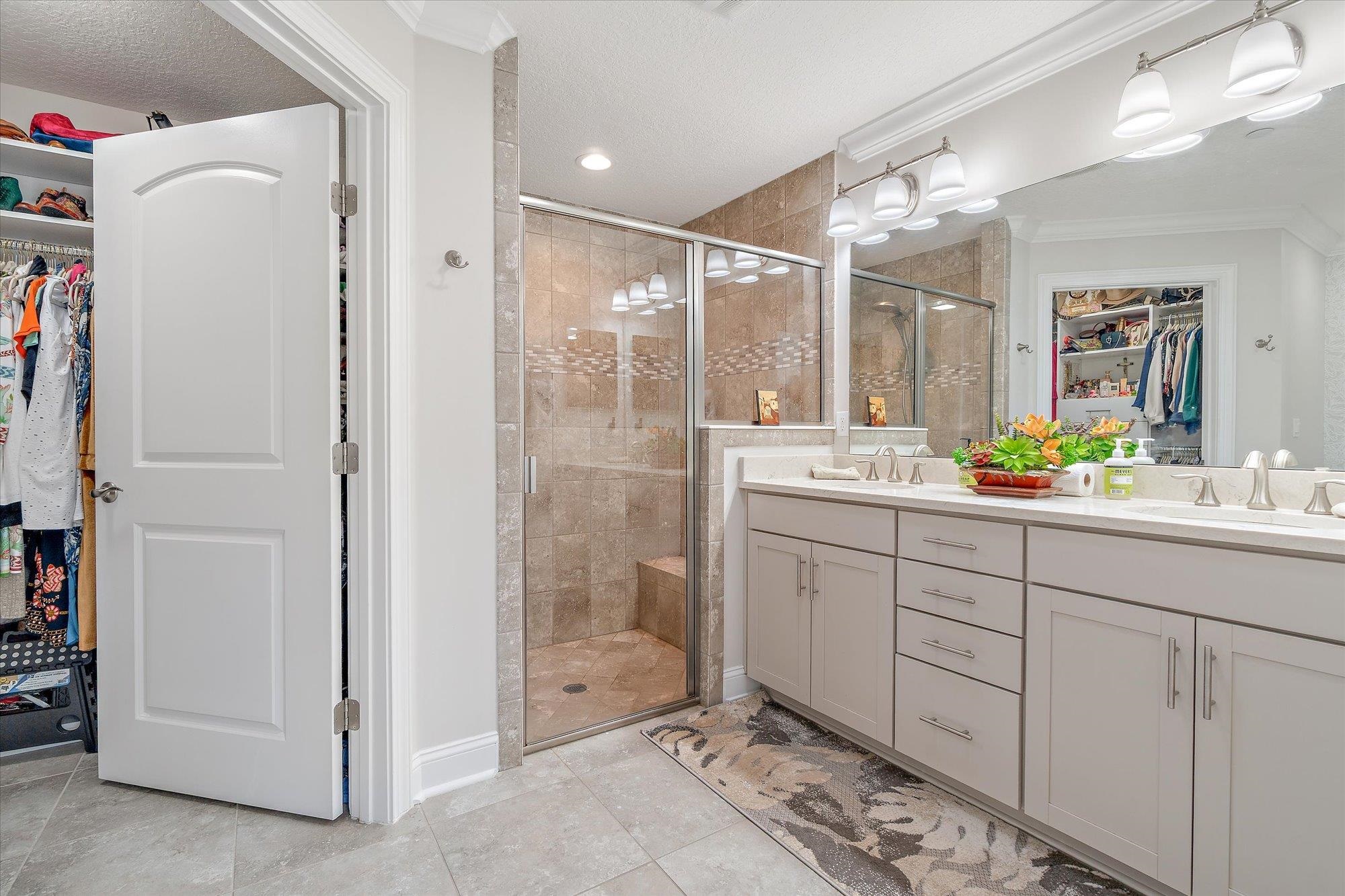 82 Timoga Trail St. Augustine, FL 32084 - Photo 26 of 62 a bathroom with a double vanity sink mirror and shower