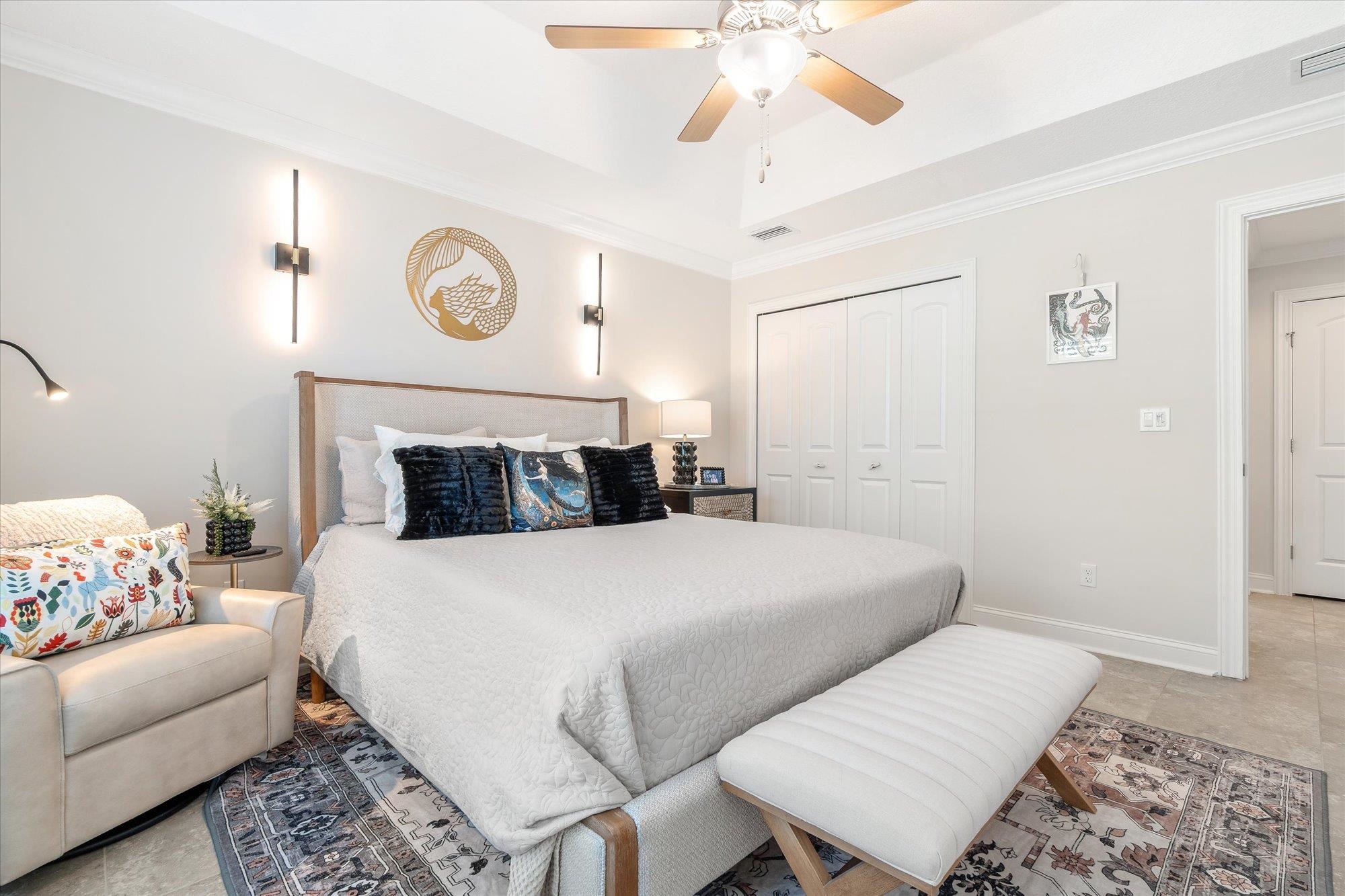 82 Timoga Trail St. Augustine, FL 32084 - Photo 31 of 62 a bedroom with a bed and a couch