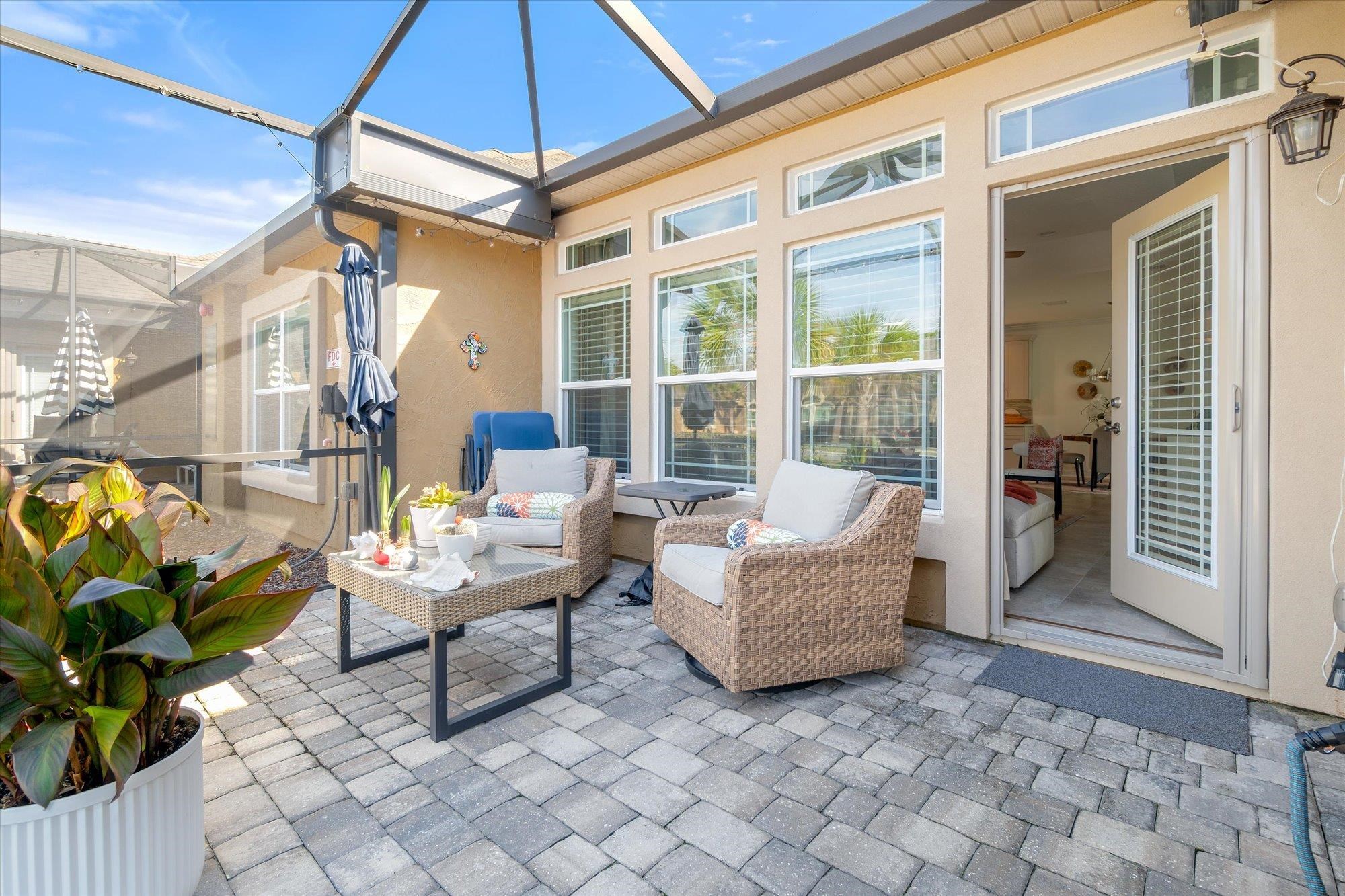 82 Timoga Trail St. Augustine, FL 32084 - Photo 33 of 62 a building outdoor space with patio furniture and potted plants