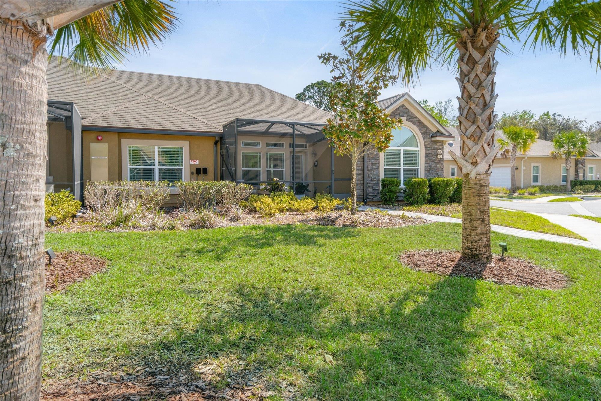 82 Timoga Trail St. Augustine, FL 32084 - Photo 5 of 62 a front view of house with yard and green space
