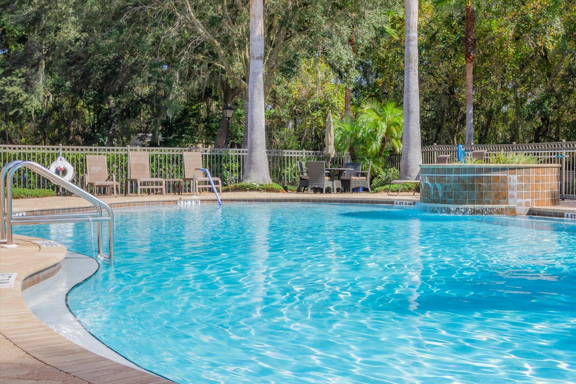 82 Timoga Trail St. Augustine, FL 32084 - Photo 56 of 62 Community pool featuring a patio area