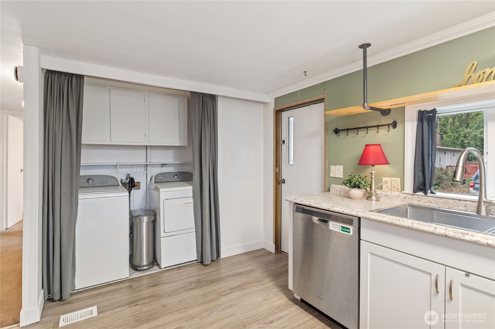 3060 Northeast McWilliams Road, Unit 52 Bremerton, WA 98311 - Photo 16 of 27 a kitchen with stainless steel appliances granite countertop a refrigerator and a sink