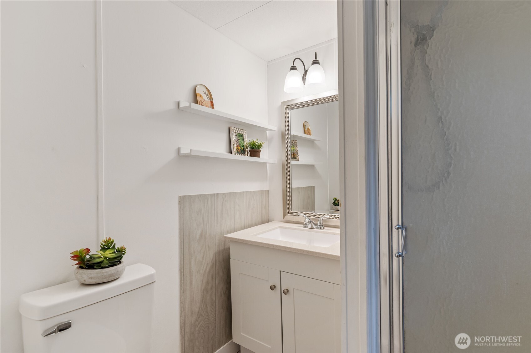 3060 Northeast McWilliams Road, Unit 52 Bremerton, WA 98311 - Photo 19 of 27 a bathroom with a sink vanity and a mirror