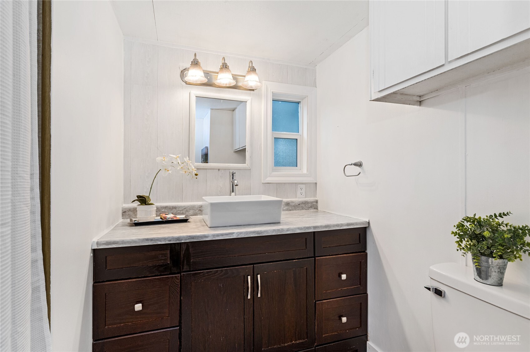 3060 Northeast McWilliams Road, Unit 52 Bremerton, WA 98311 - Photo 20 of 27 a bathroom with a sink vanity granite and a mirror
