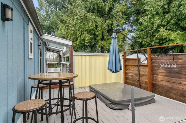 a balcony with table and chairs