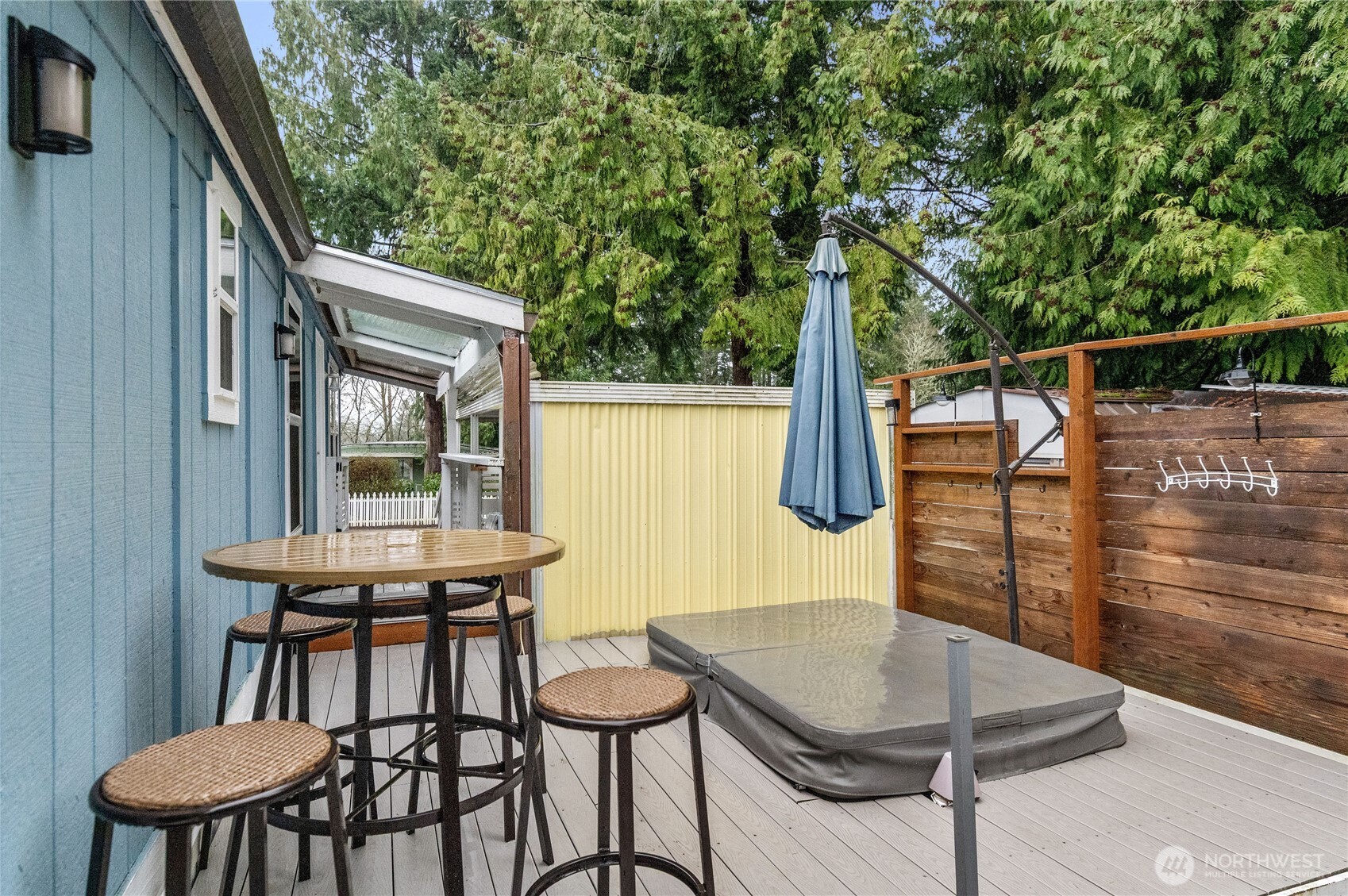 3060 Northeast McWilliams Road, Unit 52 Bremerton, WA 98311 - Photo 23 of 27 a balcony with table and chairs