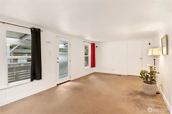 a view of an empty room with a window