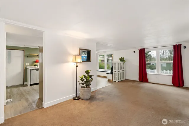 an empty room with furniture and a window