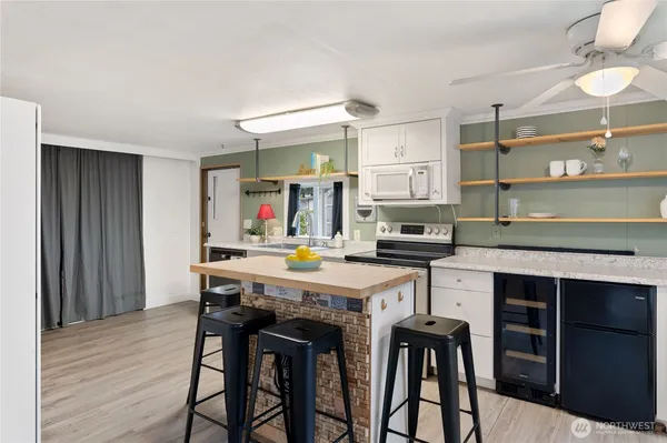 a kitchen with a table and chairs in it