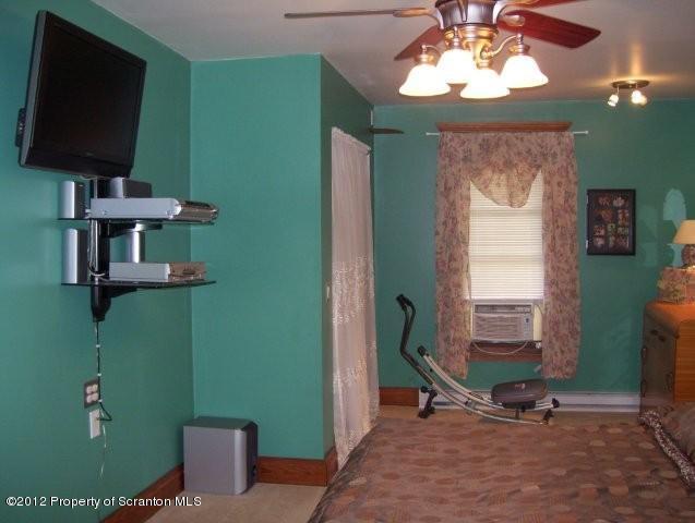 131 Mowry Road Meshoppen, PA 18630 - Photo 12 of 21 a room with furniture a flat screen tv and a chandelier