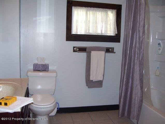 131 Mowry Road Meshoppen, PA 18630 - Photo 13 of 21 a bathroom with a toilet sink and mirror