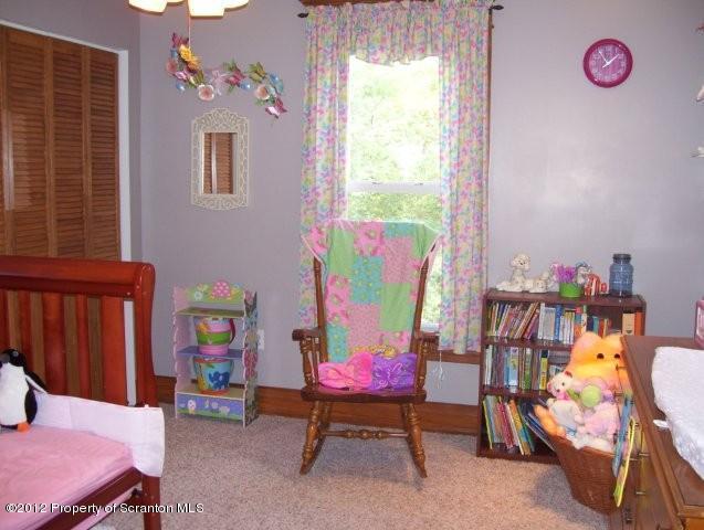 131 Mowry Road Meshoppen, PA 18630 - Photo 14 of 21 a bedroom with a bed and a table
