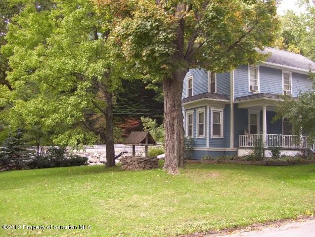 131 Mowry Road Meshoppen, PA 18630 - Photo 16 of 21 a view of a house with a yard balcony and sitting area