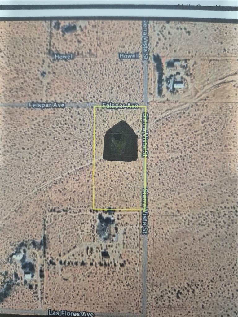 a brick wall with a shower and a sink