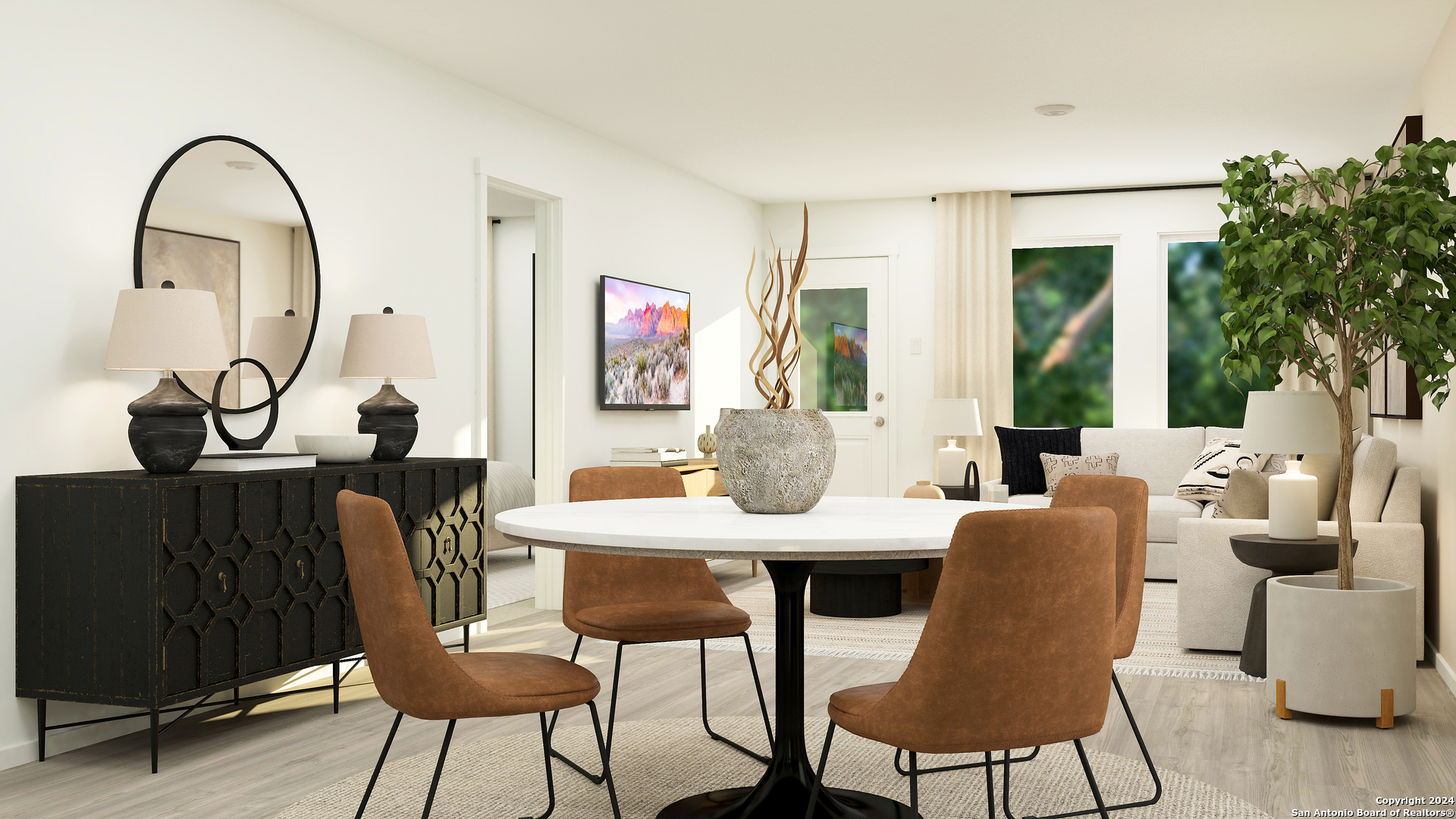 176 Bronco Ridge Pleasanton, TX 78064 - Photo 11 of 24 a view of a dining room with furniture and wooden floor