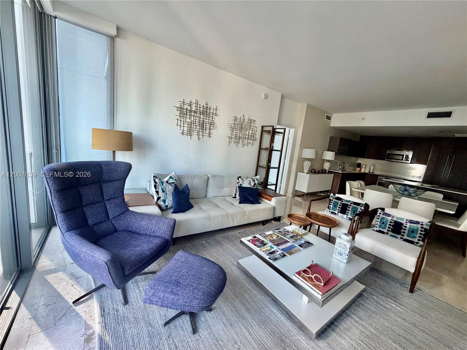 88 Southwest 7th Street, Unit 1109 Miami, FL 33130 - Photo 1 of 40 a living room with furniture and a rug