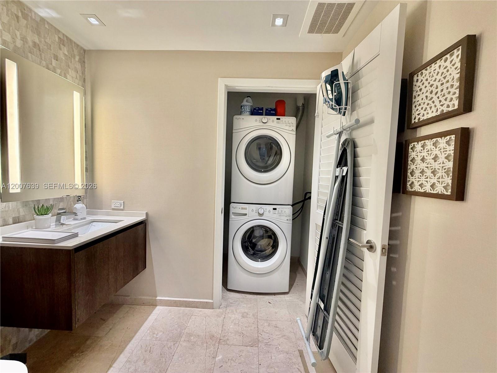 88 Southwest 7th Street, Unit 1109 Miami, FL 33130 - Photo 30 of 40 a utility room with sink dryer and washer