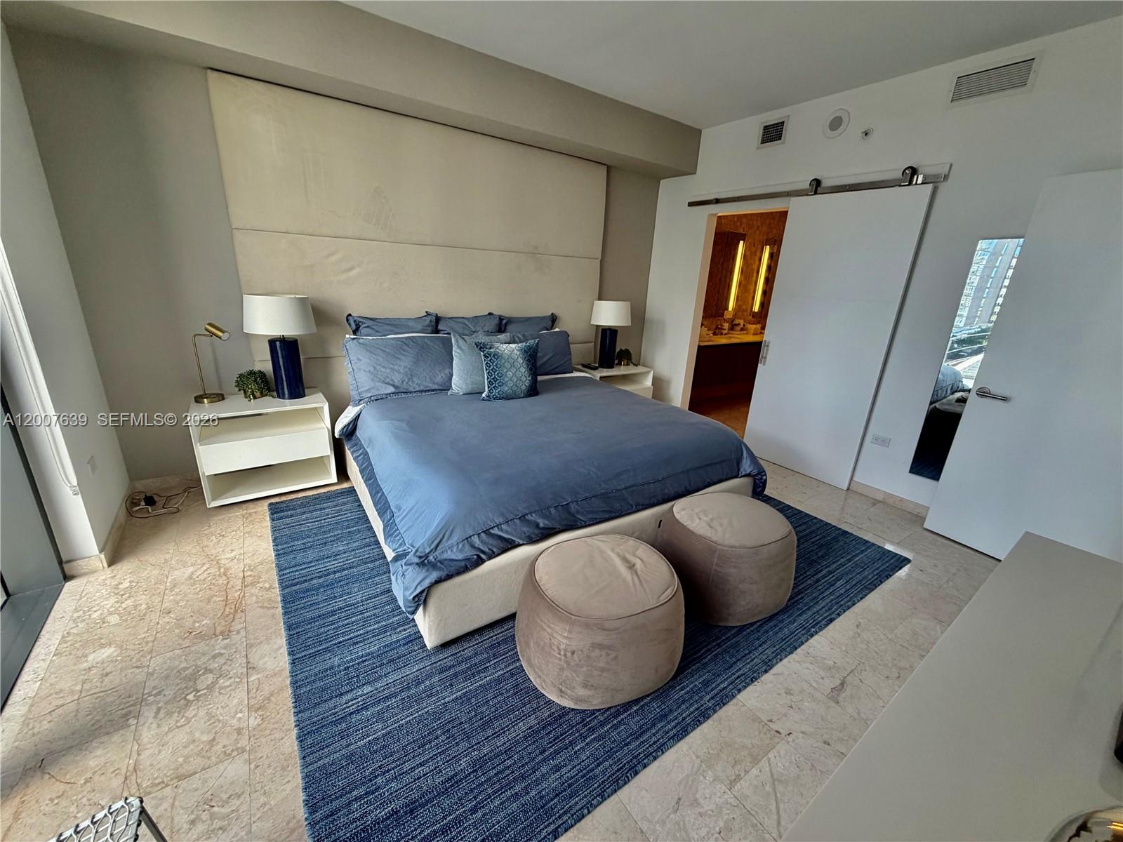 88 Southwest 7th Street, Unit 1109 Miami, FL 33130 - Photo 34 of 40 a living room with furniture and a fireplace