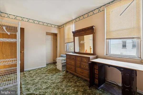 a bathroom with a sink a mirror and a shower