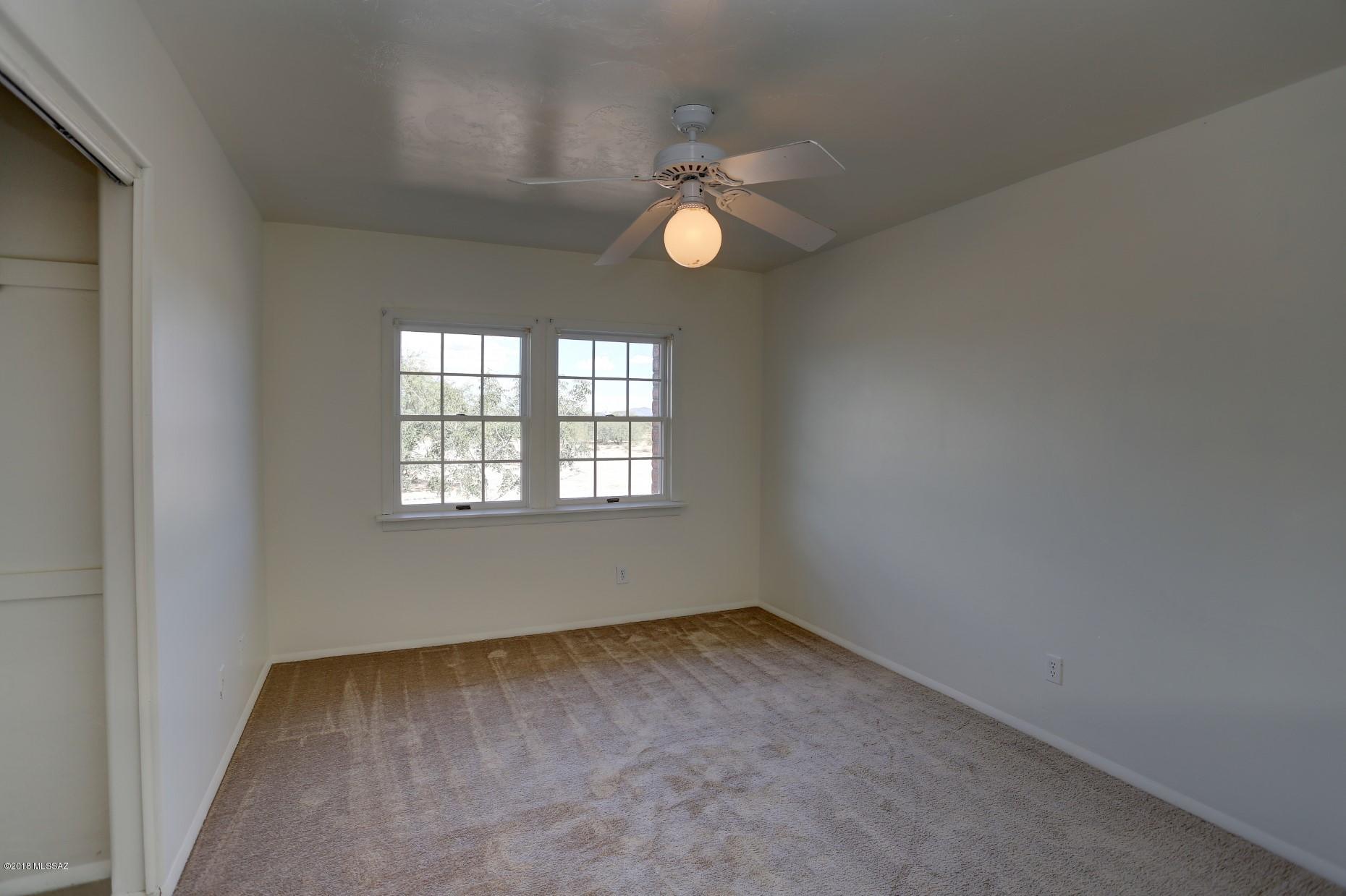5851 South Avra Road Tucson, AZ 85735 - Photo 28 of 46 an empty room with a window