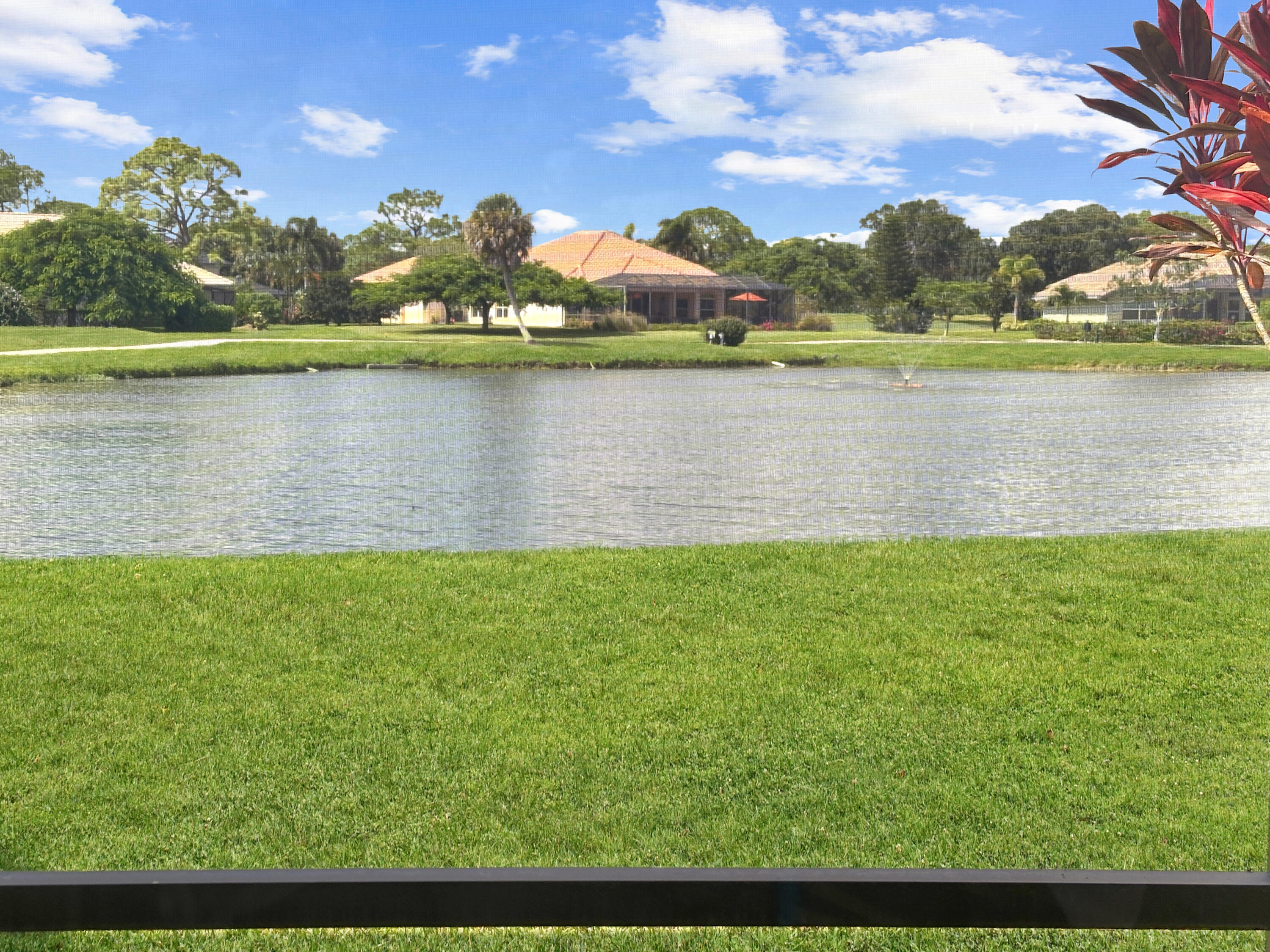 a view of a lake with a big yard
