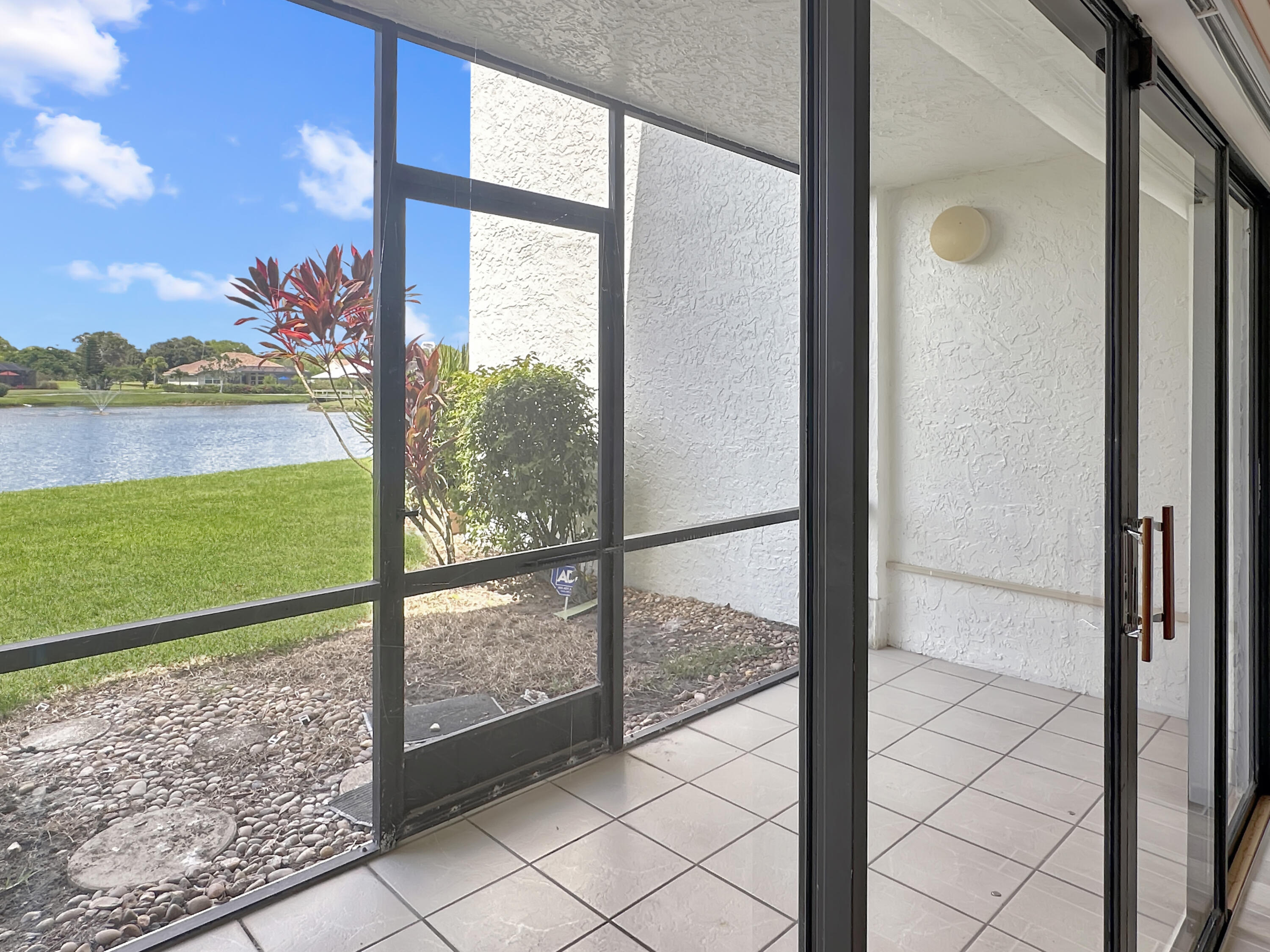 3351 Twin Lakes Terrace, Unit 102 Fort Pierce, FL 34951 - Photo 17 of 21 a view of a glass door and an outdoor shower