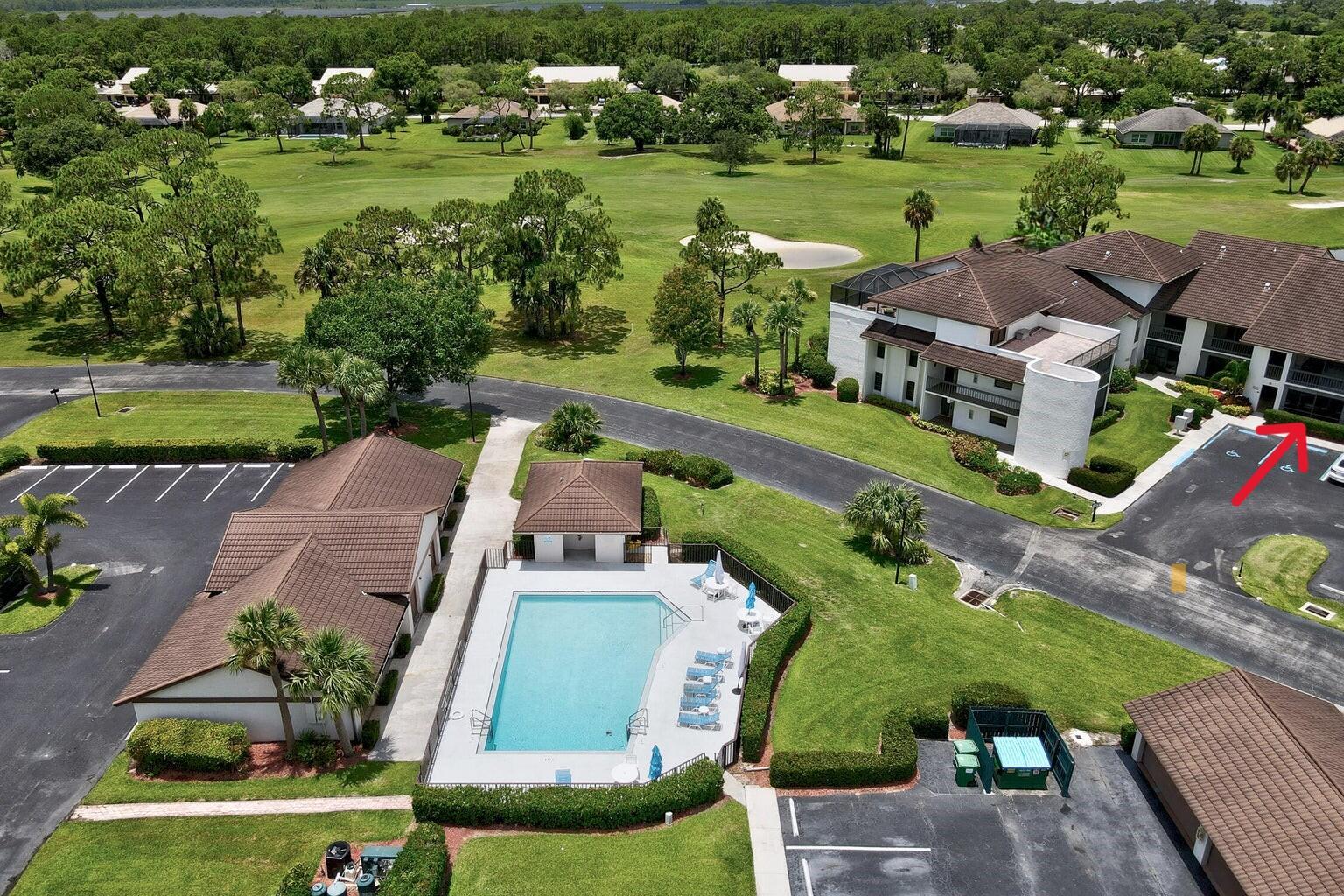 3351 Twin Lakes Terrace, Unit 102 Fort Pierce, FL 34951 - Photo 19 of 21 an aerial view of a house with a garden and lake view