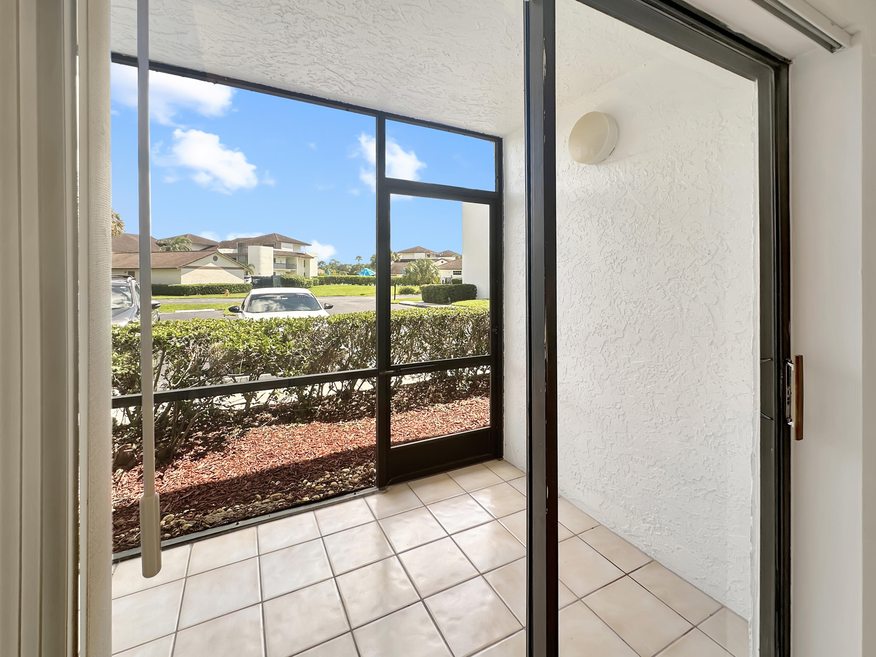 3351 Twin Lakes Terrace, Unit 102 Fort Pierce, FL 34951 - Photo 5 of 21 a view of a glass door