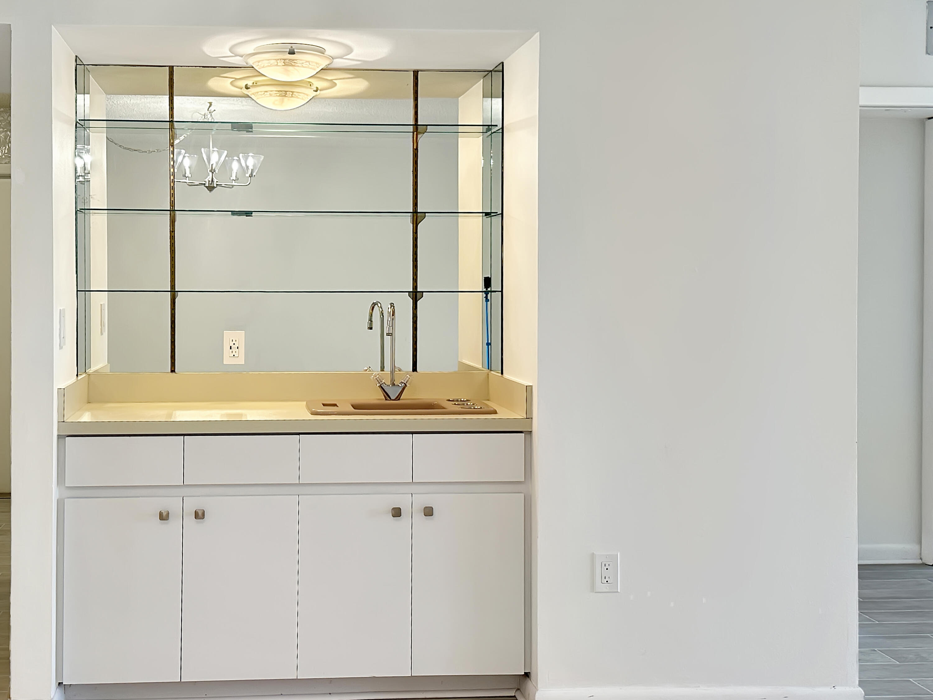3351 Twin Lakes Terrace, Unit 102 Fort Pierce, FL 34951 - Photo 7 of 21 a bathroom with a sink and a mirror