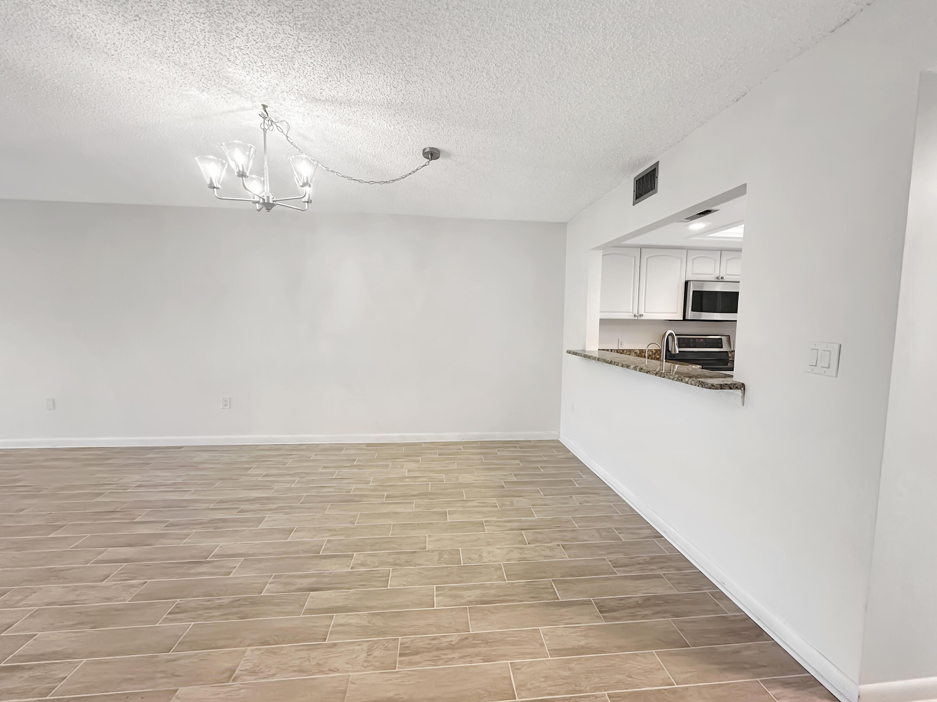 3351 Twin Lakes Terrace, Unit 102 Fort Pierce, FL 34951 - Photo 10 of 21 a view of kitchen and microwave