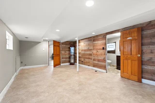 an empty room with a empty space and windows