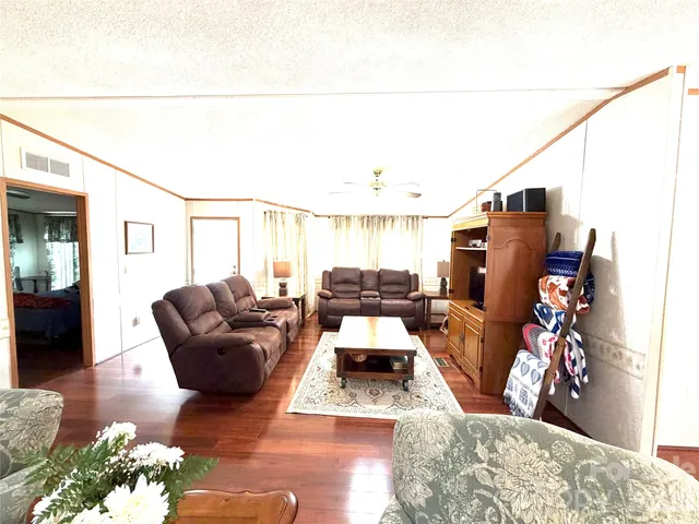 a bathroom with a sink a toilet and shower curtain