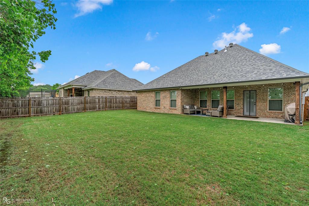 122 Brimestone Loop Benton, LA 71006 - Photo 28 of 33 a view of a house with a yard