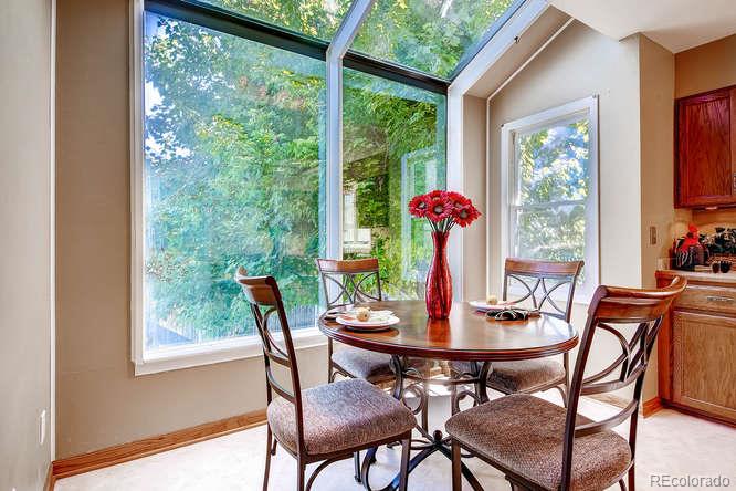 8205 Sweet Water Road Lone Tree, CO 80124 - Photo 11 of 33 a view of a dining room with furniture window and outside view