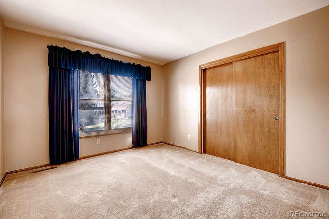 8205 Sweet Water Road Lone Tree, CO 80124 - Photo 19 of 33 an empty room with windows and closet