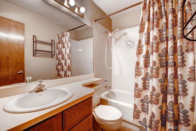 8205 Sweet Water Road Lone Tree, CO 80124 - Photo 21 of 33 a bathroom with a sink toilet tub and shower