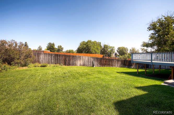 8205 Sweet Water Road Lone Tree, CO 80124 - Photo 25 of 33 a view of a yard with a trampoline
