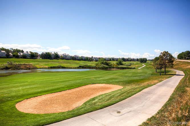 8205 Sweet Water Road Lone Tree, CO 80124 - Photo 33 of 33 a view of a golf course with a lake view