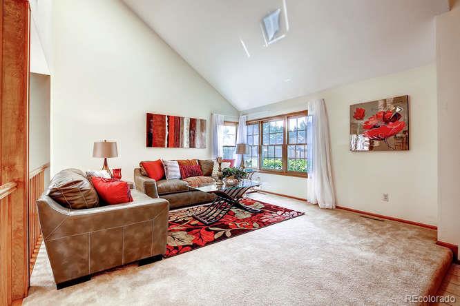 8205 Sweet Water Road Lone Tree, CO 80124 - Photo 5 of 33 a living room with furniture and a large window