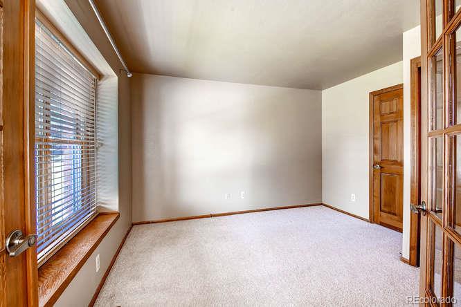8205 Sweet Water Road Lone Tree, CO 80124 - Photo 7 of 33 a view of an empty room with a window