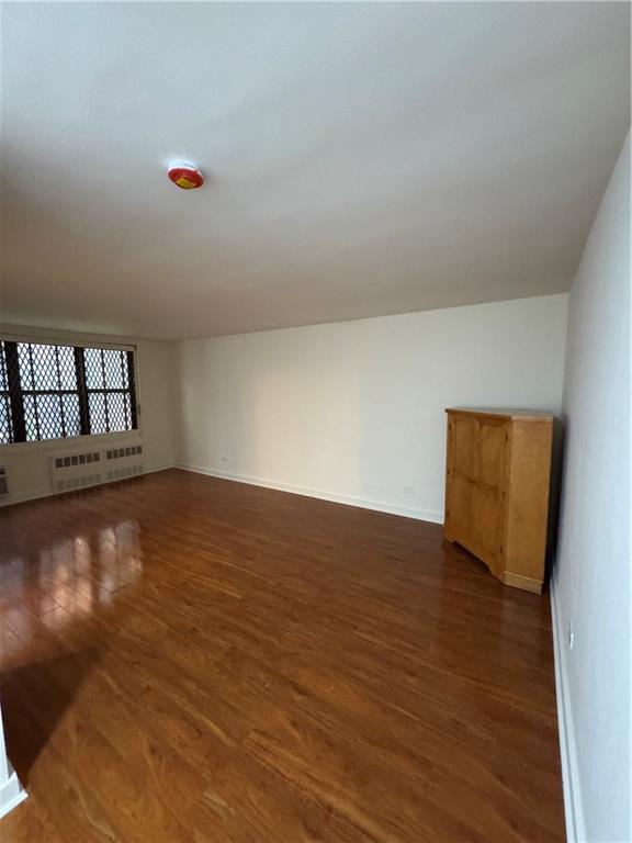 1165 East 54th Street, Unit 2Z Brooklyn, NY 11234 - Photo 6 of 14 a view of empty room with wooden floor
