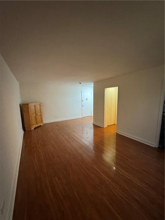 1165 East 54th Street, Unit 2Z Brooklyn, NY 11234 - Photo 7 of 14 a view of empty room with wooden floor