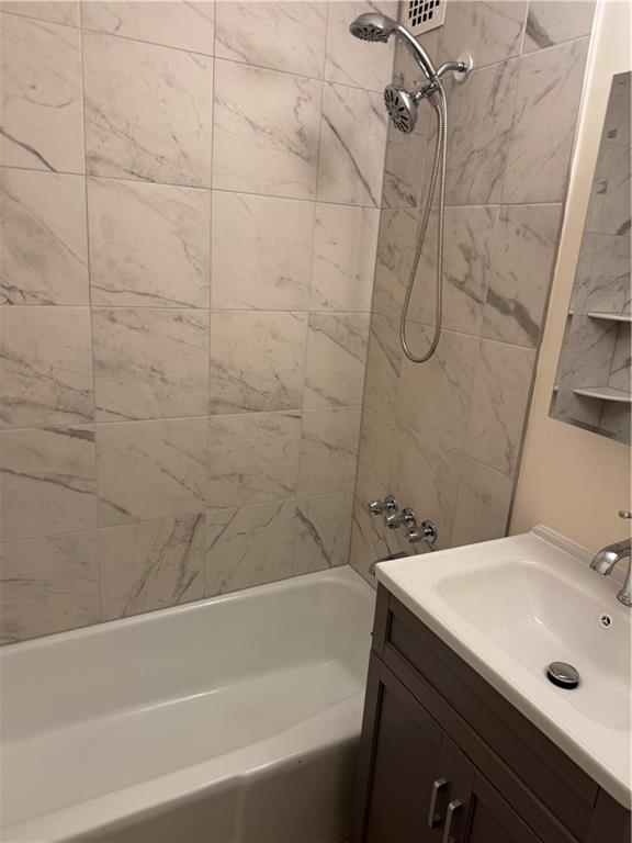 1165 East 54th Street, Unit 2Z Brooklyn, NY 11234 - Photo 8 of 14 a bathroom with a sink and a bathtub