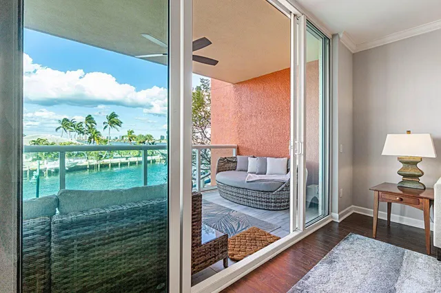 a living room with hardwood floor and furniture