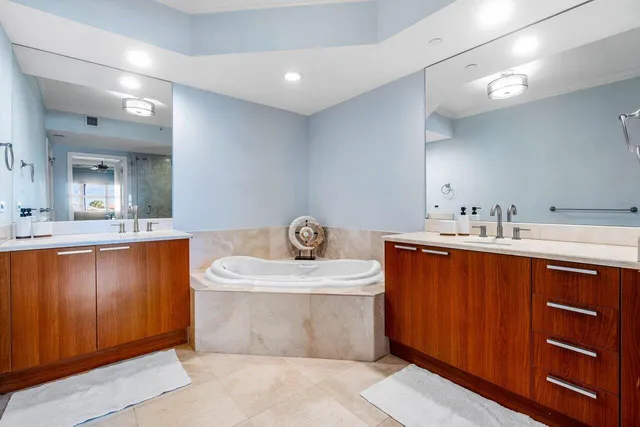 a bathroom with a shower sink and mirror