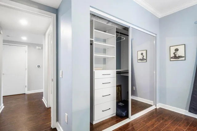 a living room with a bed and a window
