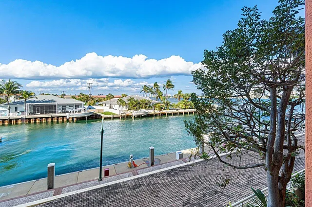 a view of swimming pool with outdoor seating and city view