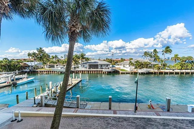 a view of a patio with a table and chairs